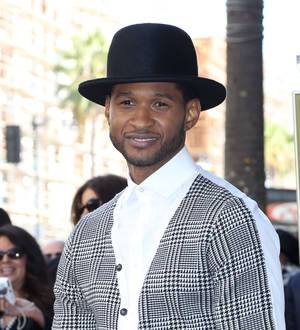 Usher loses out at charity auction after,000 bid