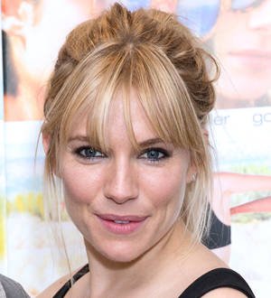 Sienna Miller sports rough hairdo at premiere