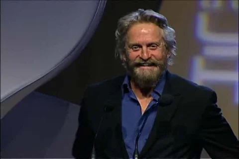 Eva Longoria presents to Michael Douglas