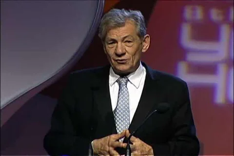 Famke Janssen Presents to Sir Ian McKellen