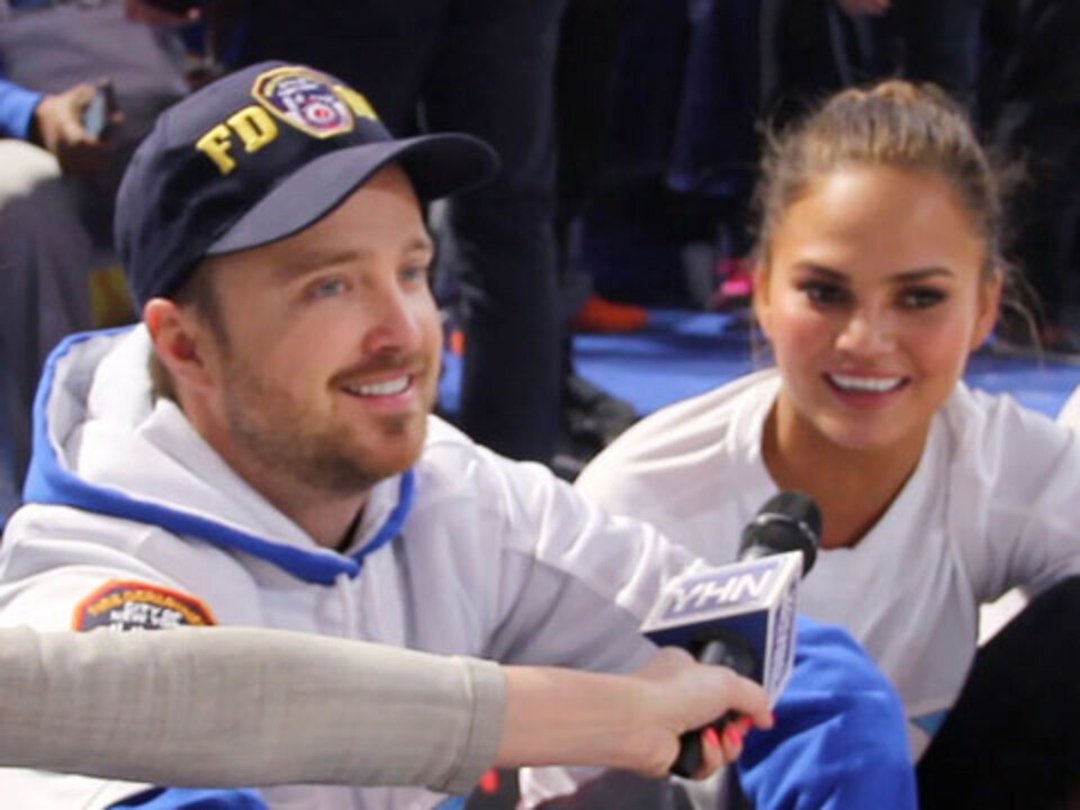 Aaron Paul & Chrissy Teigen Score at the Celebrity Beach Bowl