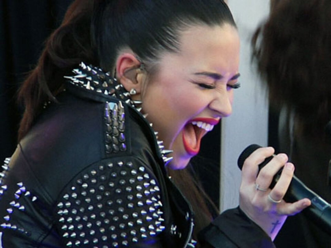 Demi Lovato Rocks Studded Foot Cast at TopShop Opening in LA